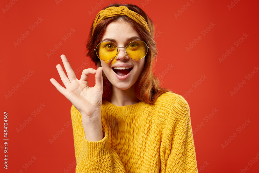 emotional woman wearing yellow glasses fashion studio posing decoration