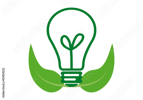 Icono verde de bombilla y hojas verdes.