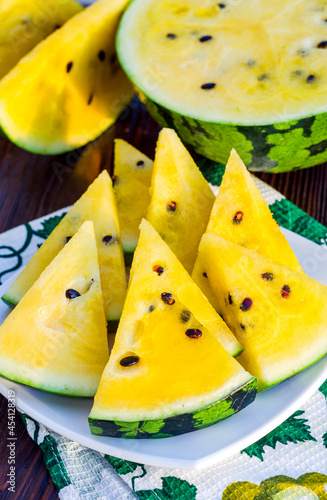 atermelon with yellow pulp on the table photo