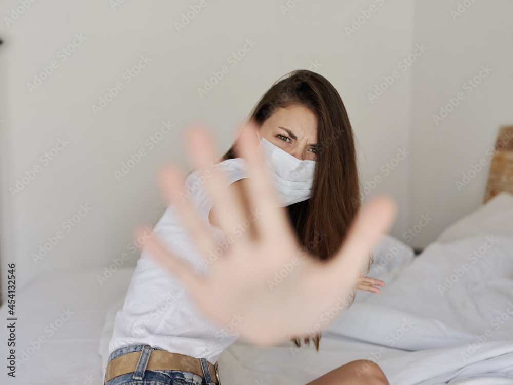 woman in medical mask in quarantine covered her face with palm aggression protest woman in medical mask in quarantine covered her face with palm aggression protest