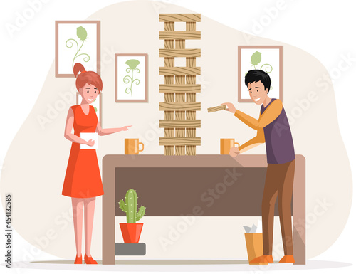 Cheerful family plays jenga in apartment. Joyful man and woman together at home communicate and rest. Home activities and entertainment. People with board games spend time in living room or office