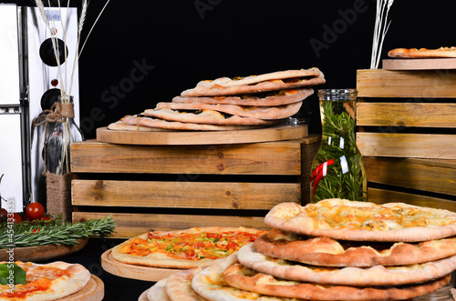 Fresh pizza with tomatoes, cheese and mushrooms on wooden table closeup