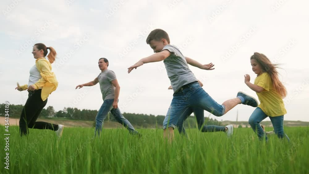 happy family run. children kid a together run in the park at sunset. people in the park concept. mom dad daughter and fun son joyful run energy. happy family and little baby child kid dream concept