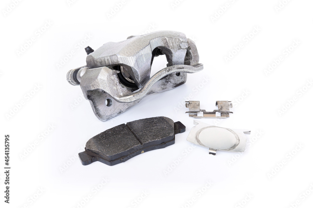 Obraz premium Standard brake caliper of car brake pad and lock part in white background