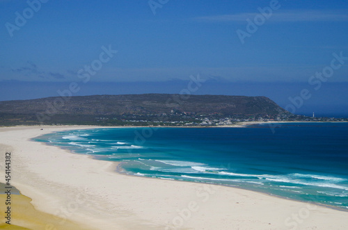 Breathtaking scenic view of beautiful sandy beaches and rocky bays on coastal shoreline of Cape Region in Cape Town Peninsula, South Africa with ocean panorama, surf and nature landscape