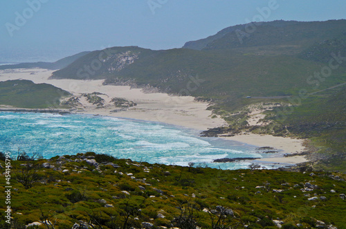 Breathtaking scenic view of beautiful sandy beaches and rocky bays on coastal shoreline of Cape Region in Cape Town Peninsula, South Africa with ocean panorama, surf and nature landscape