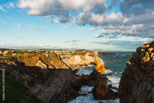 Rocky coast of sea in sunny day photo