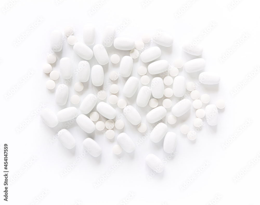 White pills on a White background. Healthcare and medicine. White pills on a White background. Healthcare and medicine.