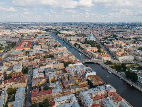 Aerial view of historical center of St Petersburg. Photo of Fontanka river, Trinity Cathedral, Nikolskie ryady and many old living houses. Cloudy blue sky. Russian cities. Place for vacation.