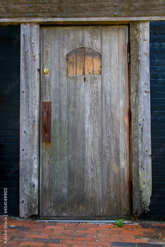 Old wooden door on the front of a hous