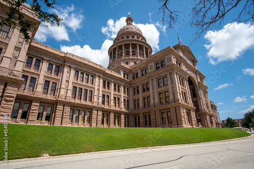 Side view of the Austin Capitol Building With Mostly Clear skies during the summer days