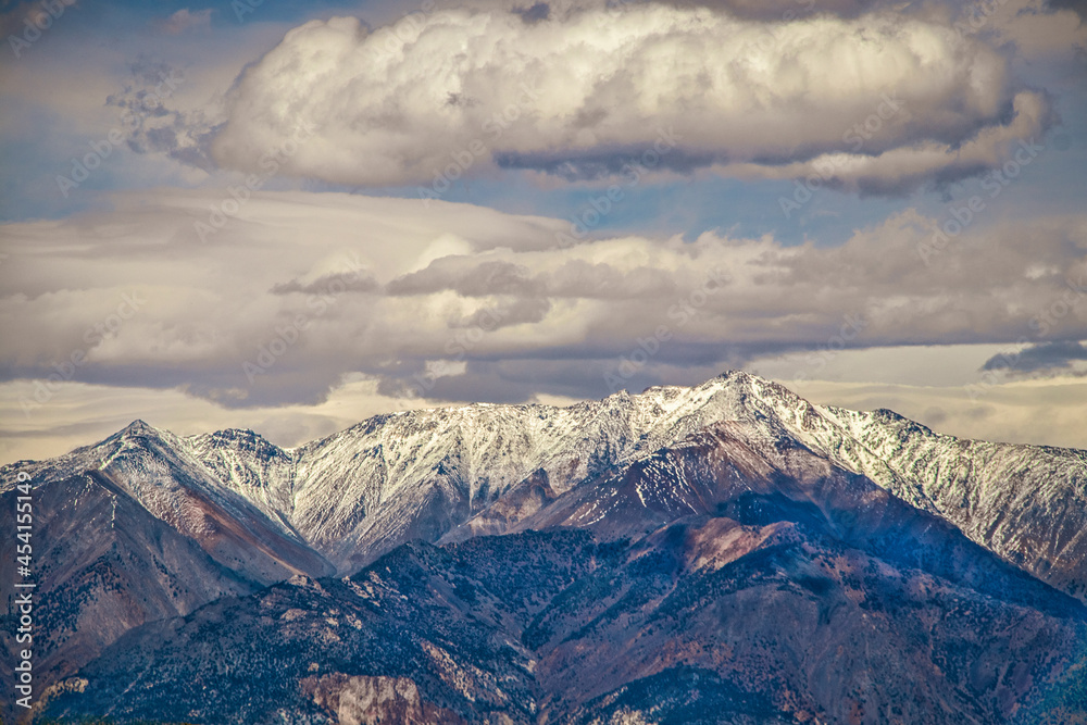 Puple mountains - majestic Sierra Nevanda range of eastern California  USA with snow-topped peaks under dramatic sky.
