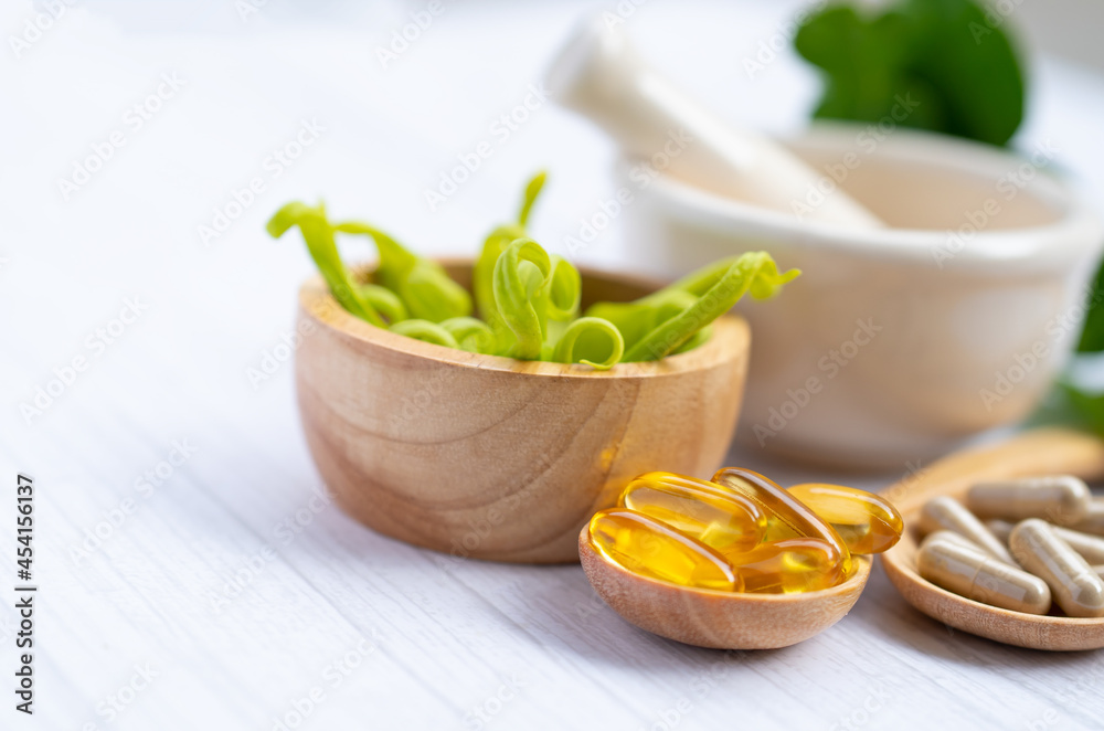 Alternative medicine herbal organic capsule with vitamin E omega 3 fish oil, mineral, drug with herbs leaf natural supplements for healthy good life. Alternative medicine herbal organic capsule with vitamin E omega 3 fish oil, mineral, drug with herbs leaf natural supplements for healthy good life.