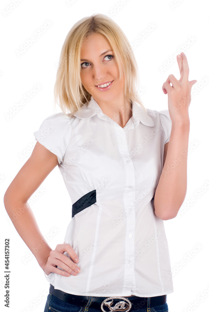 Young attractive woman showing crossing fingers gesture over isolated white background Young attractive woman showing crossing fingers gesture over isolated white background