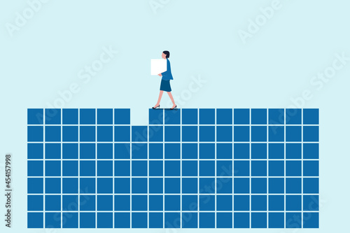 Young woman building blue grid pattern. Concept of decision making process, logical thinking. find the missing piece of the proposed. Concept puzzle of financial management.
