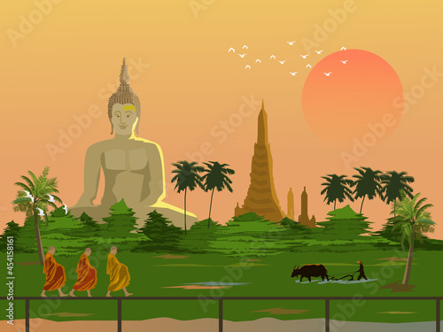 Morning atmosphere in rural Thailand.Three monks making alms .Farmers plowing with buffalo.Big Buddha and pagoda in the background