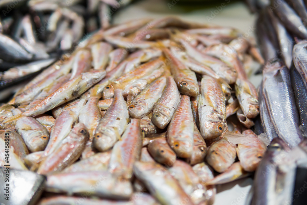 Fresh fish displayed in a traditional food market, red mullets