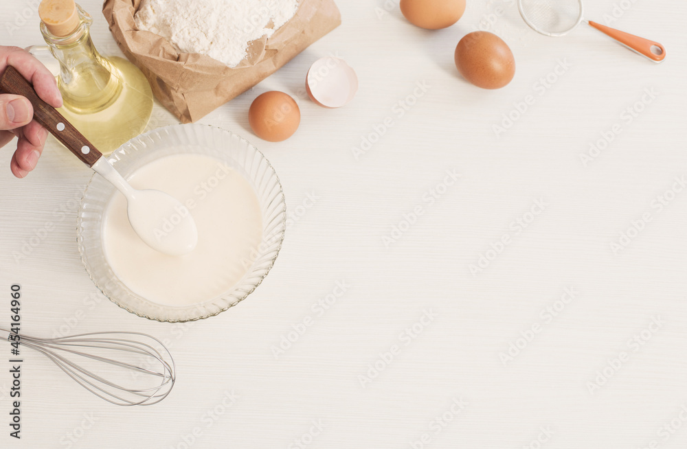 dough in glass plate and products for its preparation on white background dough in glass plate and products for its preparation on white background