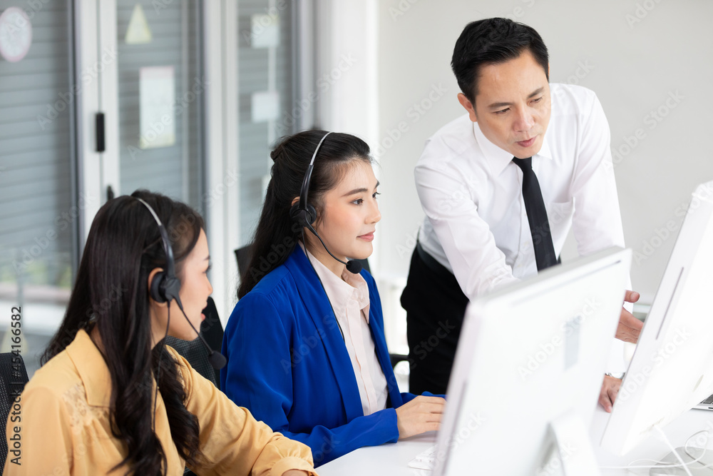 businessman supervisor training and suggesting about work to colleagues at call center service businessman supervisor training and suggesting about work to colleagues at call center service