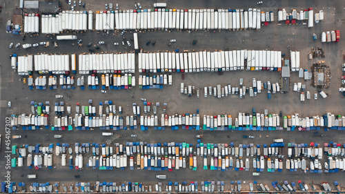 Large and small trucks with goods on the market