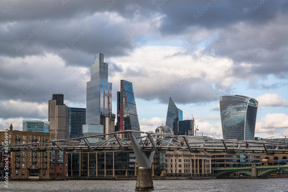View of the City of London past the Millennium bridge, London, England, UK View of the City of London past the Millennium bridge, London, England, UK