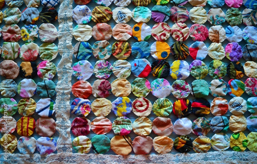 Fabric circles with lace forming a quilt