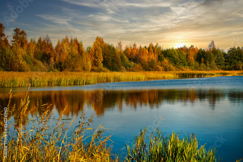 Autumn landscape with lake and the forest on the shore.