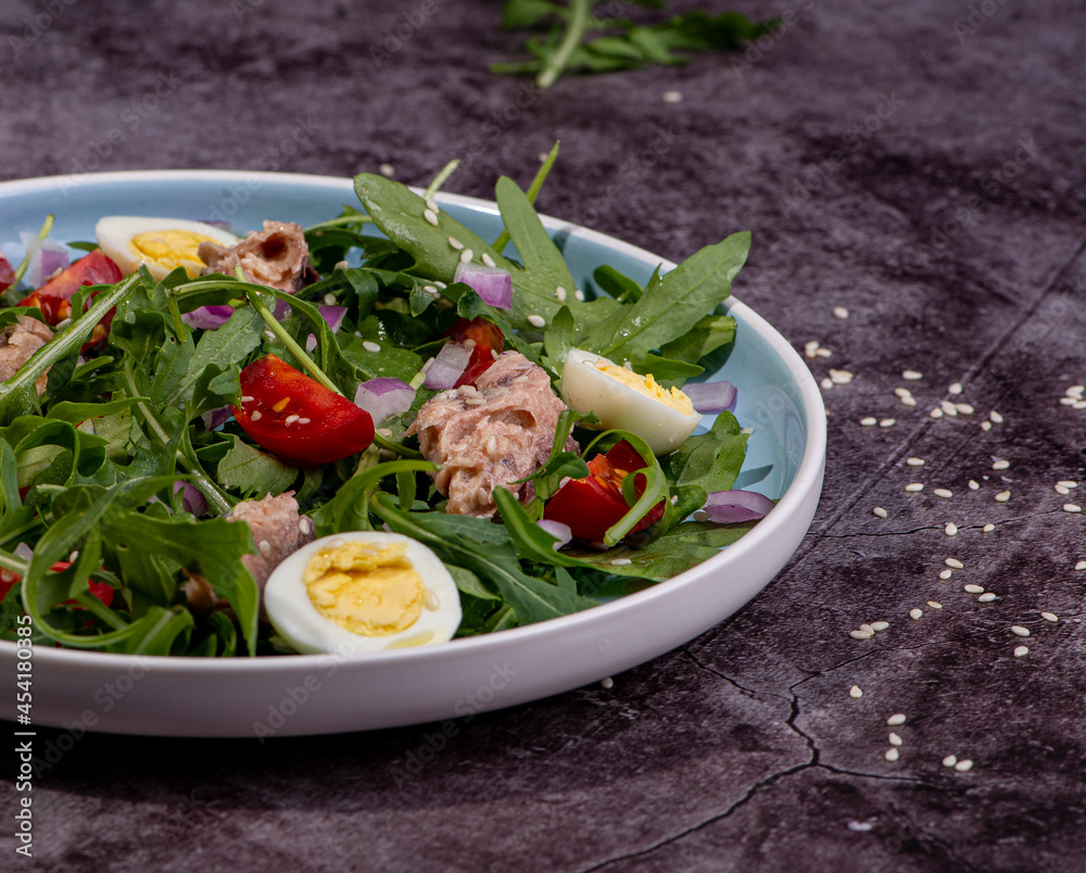 fresh salad with canned mackerel, arugula and tomatoes fresh salad with canned mackerel, arugula and tomatoes