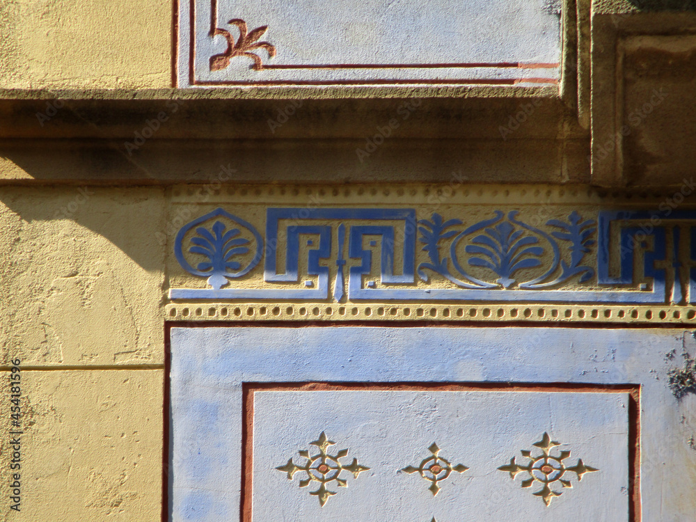 Streets of Barcelona. Detail of facade with sgrafitto decoration in the historic city center. Catalonia. Spain. Streets of Barcelona. Detail of facade with sgrafitto decoration in the historic city center. Catalonia. Spain.