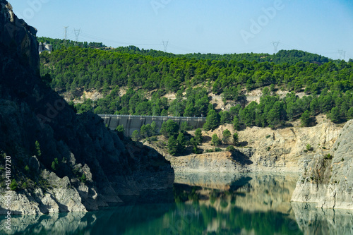 Turquoise water in the Contreras Reservoir Dam, right on the border of Castilla la Mancha with the Valencian Community, in Spain. Europe. Horizontal photography. World Environment Day, June 5, 2022