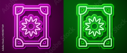 Glowing neon line Ancient magic book with alchemy recipes and mystic spells and enchantments icon isolated on purple and green background. Vector