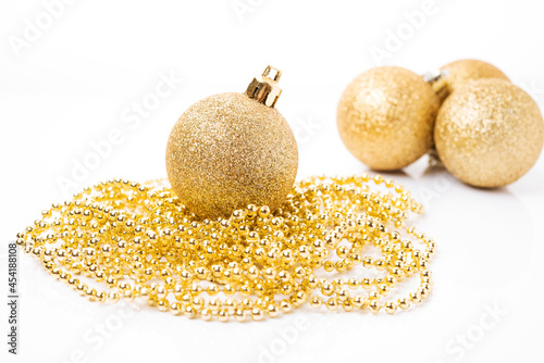 Christmas golden ball for Christmas tree decoration and holiday decorations on white background, Christmas toys