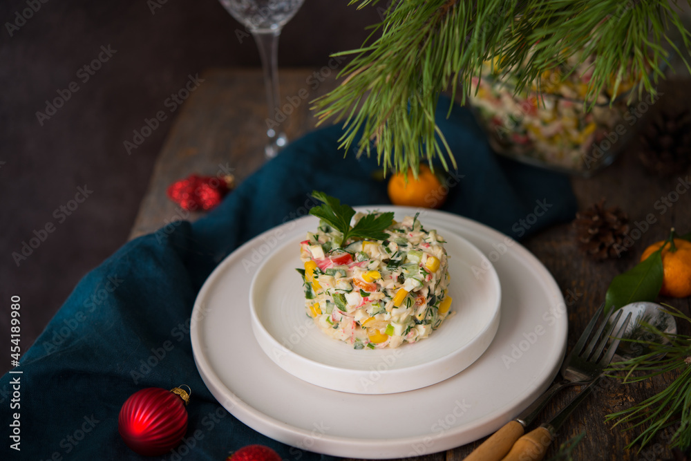 New Year's holiday salad with mayonnaise, New Year's table, champagne New Year's holiday salad with mayonnaise, New Year's table, champagne
