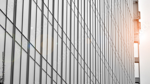 Wallpaper Mural Modern architectural details. Modern glass facade with a geometric pattern. Contemporary corporate business architecture. Red sun on horizon. Black and white toned image. Torontodigital.ca