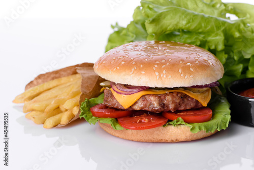 Craft beef burger and french fries on a white background
