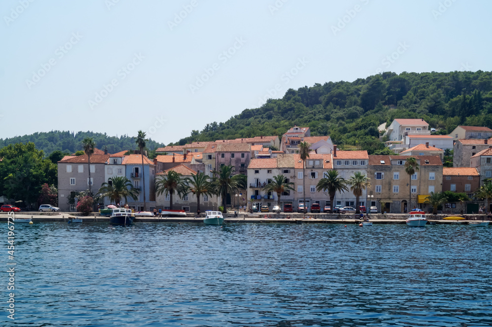 Croatia, Korcula view from seaside to odl town and small harbor.