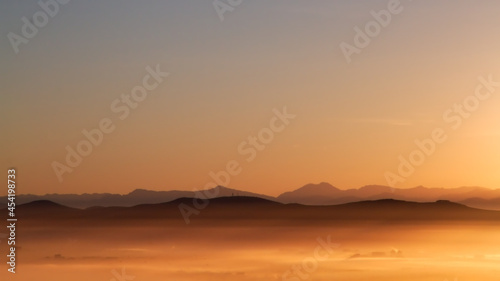 Early morning Sky with mist over a valley