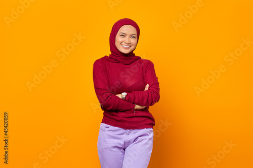 Attractive asian woman standing with crossed arms feels confident © Bangun Stock Photo