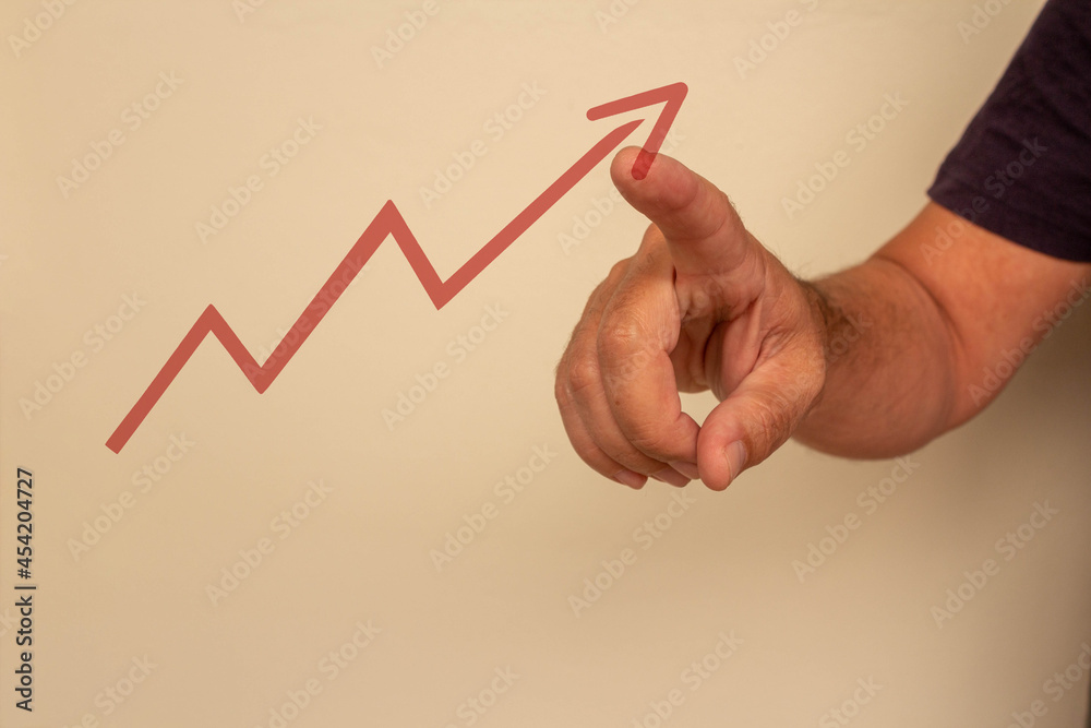 Man analyzing, pointing to graph Man analyzing, pointing to graph