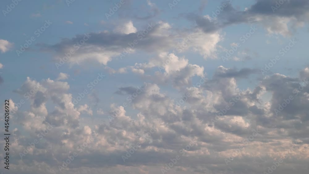 Beautiful blue sky background. Clouds slowly moving at sunset sky Beautiful blue sky background. Clouds slowly moving at sunset sky