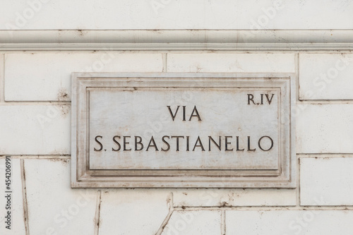 marble plate with street name via San Sebastianello - engl: San Sabastianello street - at the wall in Rome
