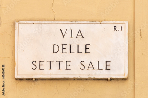 Fototapeta Naklejka Na Ścianę i Meble -  marble plate with street via delle sette sale- engl: sette street - at the wall in Rome