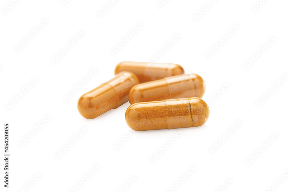 Turmeric Capsule isolated on white background with clipping path Turmeric Capsule isolated on white background with clipping path