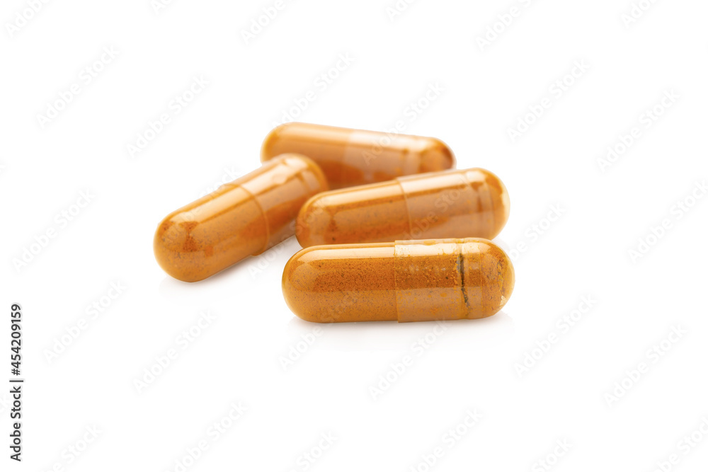 Turmeric Capsule isolated on white background with clipping path Turmeric Capsule isolated on white background with clipping path