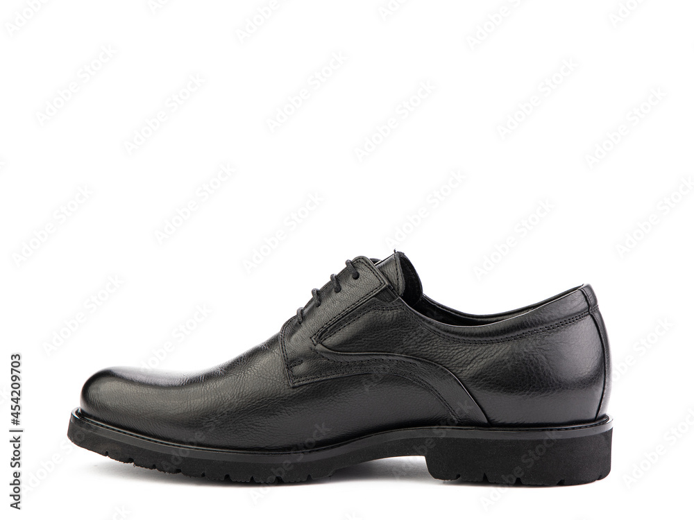 A pair of classic leather elegant men's shoes isolated white background. Groom's stylish black shoes. Isolated object close up on white background. Left side view. A pair of classic leather elegant men's shoes isolated white background. Groom's stylish black shoes. Isolated object close up on white background. Left side view.