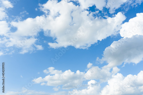 Cirrus and cumulus clouds on blue sky background..