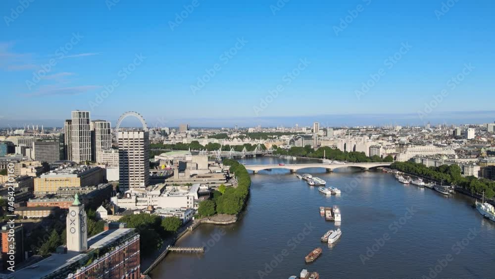 river flowing through city. Aerial panoramic view of town. London eye tourist attraction in background. London, UK river flowing through city. Aerial panoramic view of town. London eye tourist attraction in background. London, UK