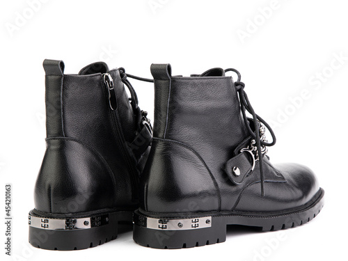 Women's autumn black leather boots jodhpur, with lance isolated on white background. Back side view. Fashionable shoes. Photo shoot for shoe store concept.
