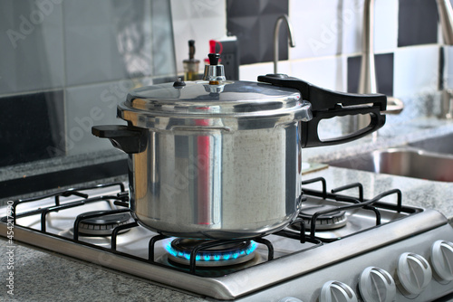 Pressure cooker under the stove fire photo