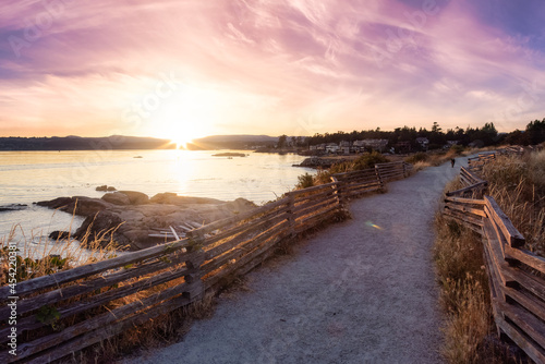 Scenic Path Trail in a Park by the Coastline on the West Pacific Ocean Coast. Summer Sunset Sky Art Render. MacAulay Point Park in Victoria  Vancouver Island  British Columbia  Canada.